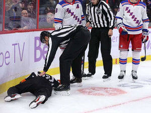 Referee Tim Peel Leaves Game After Being Hit in the Head with a Puck
